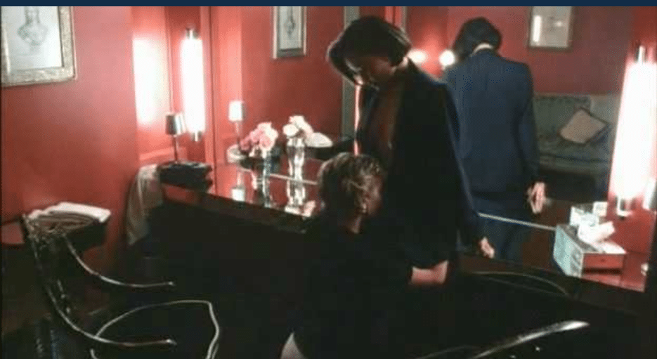 Anne Heche and Joan Chen lesbian kissing in a dressing room.