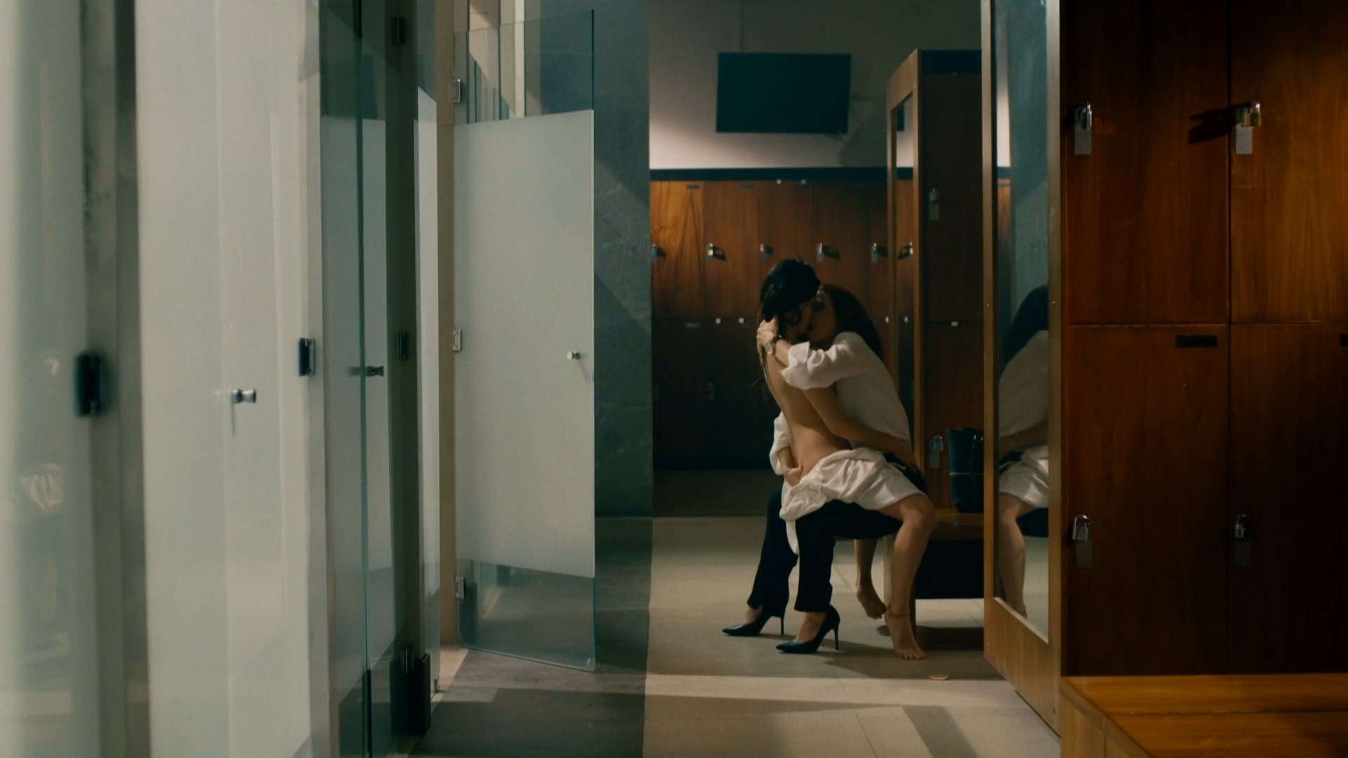 Marianna Burelli grab Alicia Jaziz`s butt while lesbian kissing her as they make out in a locker room